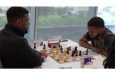 FM Joshua Johnson of Trinidad (left) faces FM Joshua Christie of Jamaica in round five of the CARICOM Classic Chess Team tournament