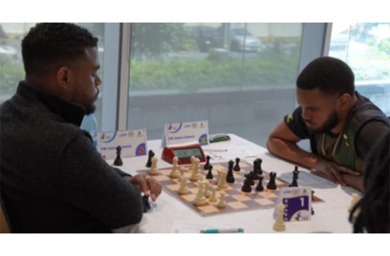 FM Joshua Johnson of Trinidad (left) faces FM Joshua Christie of Jamaica in round five of the CARICOM Classic Chess Team tournament