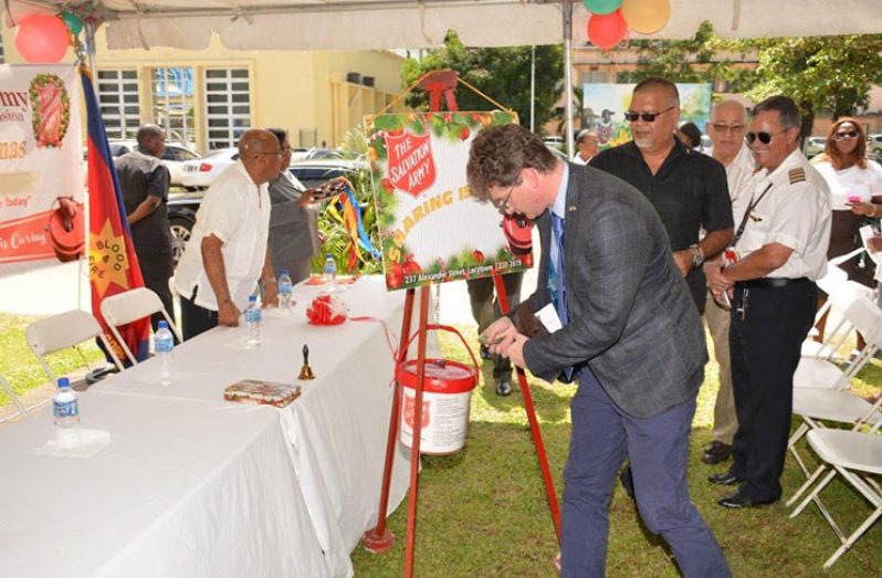 British High Commissioner Mr. Gregg Quinn and members of the private sector making their donations to the Christmas Kettles back in 2015