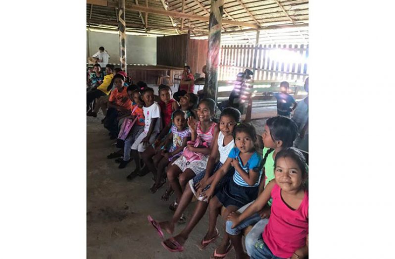 Moraikobai children awaiting their toys from ‘Savannah Drive’