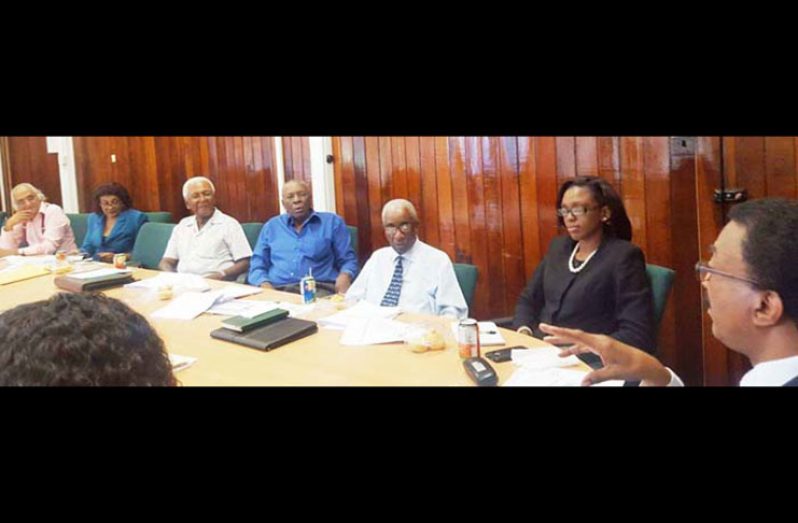 Christopher Ram (left) seated among other top jurists, including James Patterson, at a recent advisory committee meeting. In photo also is Attorney-General Basil Williams