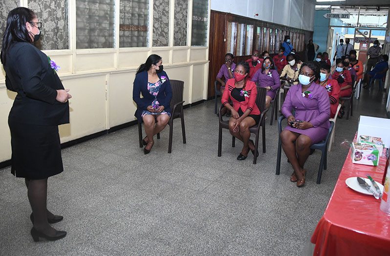 In observance of International Women’s Day, the Guyana Chronicle on Monday celebrated its women by treating them with wine and cake. In this photo, General Manager Moshamie Ramotar interacts with the female staff, encouraging them to continue breaking the ‘glass ceiling’ (Adrian Narine photo)