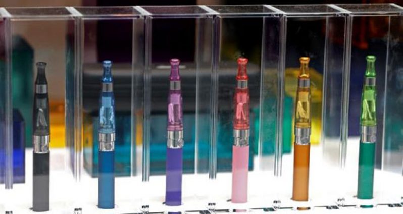 A window display with different colour models electronic cigarettes is seen in a shop in Paris