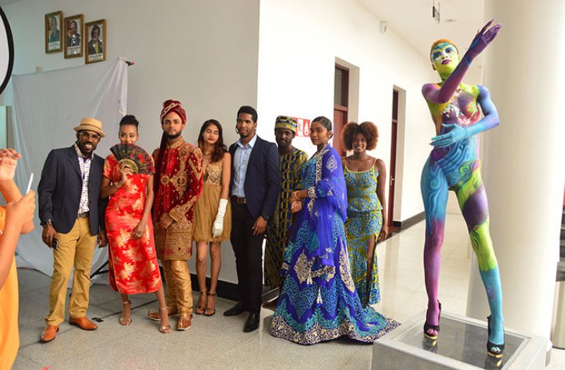 Chief Executive Officer (CEO) of the Cineffx Film and Photo expo, Jason October (centre) with models at the expo being held at the Arthur Chung Conference Centre (Adrian Narine photo)
