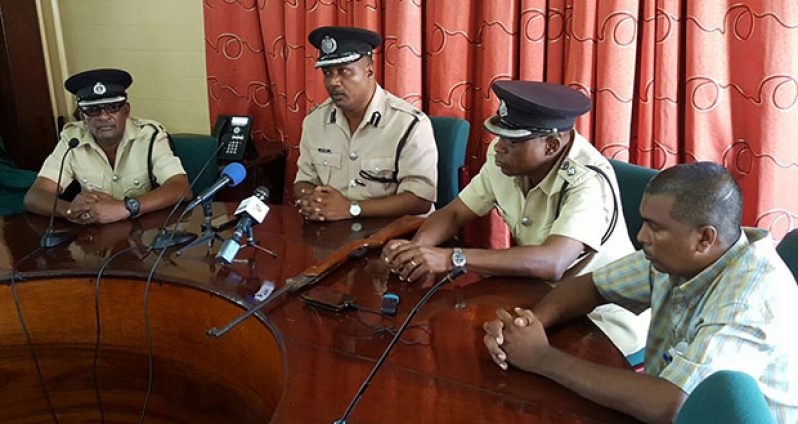 Chief Constable Andrew Foo (second from left) with the rifle next to him during the press briefing on Thursday