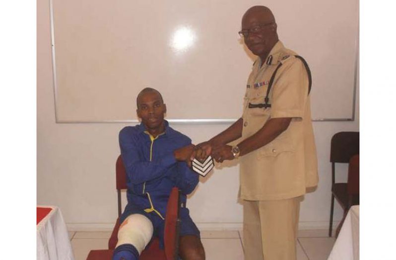 Police Corporal Clive Clarke, who was injured during the shootout on Norton Street which left three bandits dead, has been promoted to the rank of Sergeant (GPF photo)
