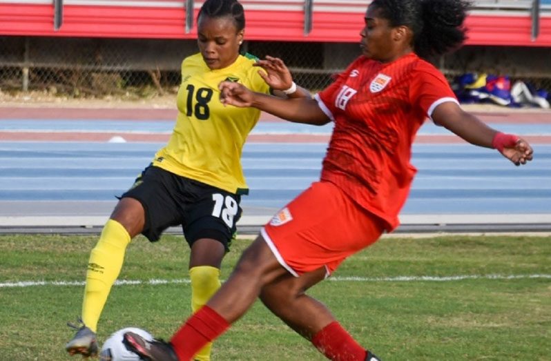 Part of the action in the Jamaica, Cayman Islands clash on Saturday.