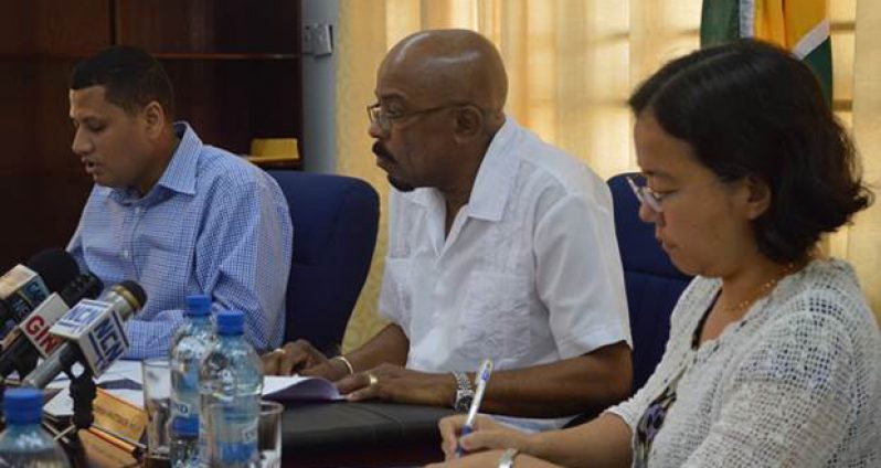 (L-R) Permanent Secretary of the Ministry of Local Government and Regional Development, Collin Croal, Minister of Local Government, Norman Whittaker, and Deputy Resident Representative of UNDP, Ms. Chisa Mikami at the Ministry’s boardroom where contracts for the rehabilitation of six municipal markets were signed