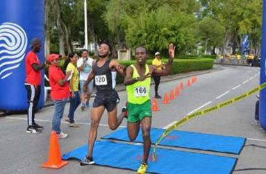 Cleveland Thomas dips ahead of Winston Missigher to take the men’s 10k win.