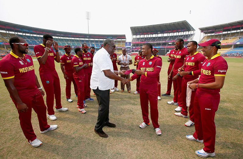 Evin Lewis receives his West Indies cap from Clive Lloyd,
Afghanistan v West Indies, World T20 2016, Group 1, Nagpur,
March 27, 2016. (©️IDI/Getty Images)