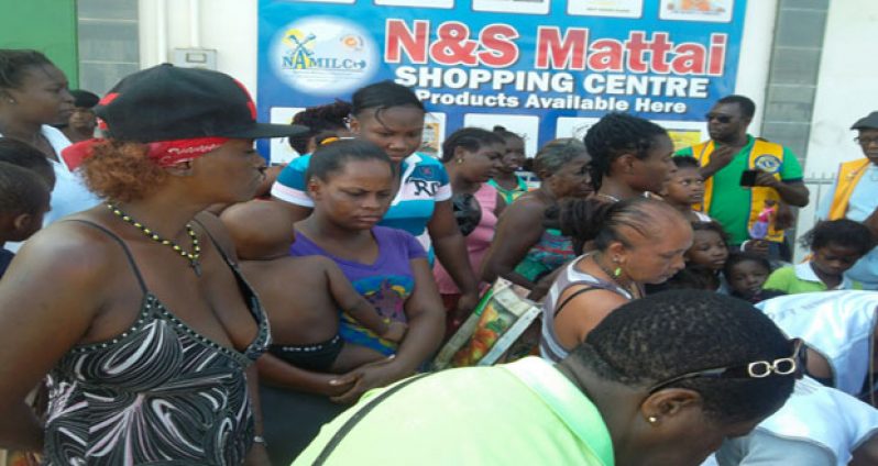 A section of the large crowd that received brand new clothing from Caring for Others Inc yesterday