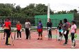Coach Rawle Merrel takes the ladies through their drills last Saturday on the Basketball Court of the National Gymnasium