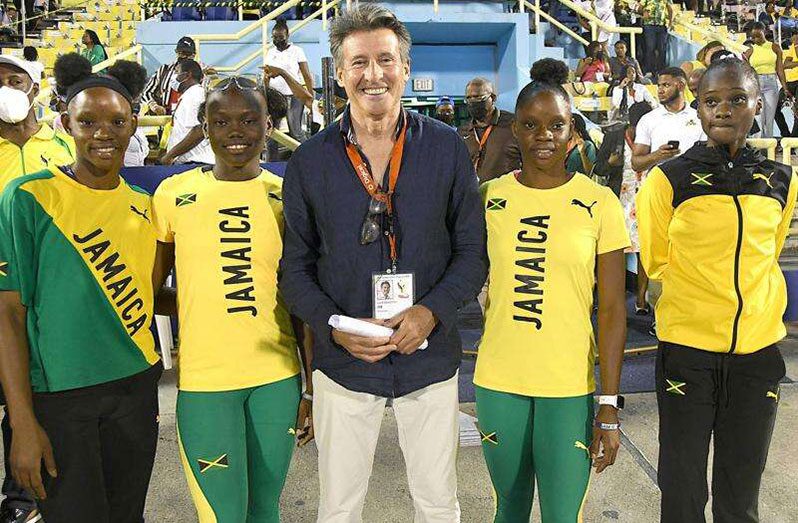 Sebastian Coe (centre), president of IAAF, poses with members of Jamaica’s Under-20 4x100m record-breaking relay team during the CARIFTA Games on Monday, April 18, 2022 at the National Stadium. The record breakers are (from left) Tina Clayton, Serena Cole, Tia Clayton and Brianna Lyston (Photos: Observer file)