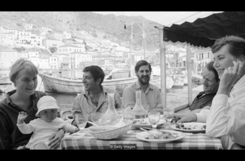 Cohen met his muse Marianne Jensen on the Greek island of Hydra; she is pictured next to him, left, with her son Axel Jensen Jr in October 1960 (Credit: Getty Images)