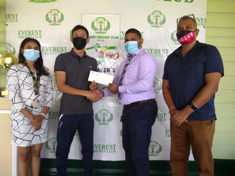 Miguel Wong (second left) collects the sponsorship from ECC member Javid Khan in the presence of other club officials, Ramdeo Kumar (right) and Krista Norton.