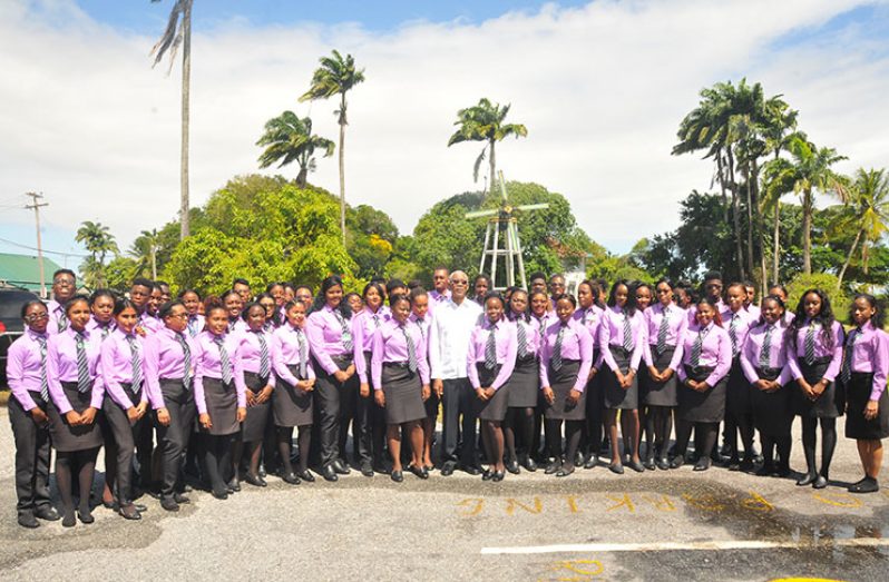 President David Granger stands with the 2017 graduating class of the Bertram Collins College of the Public Service Monday (Adrian Narine)