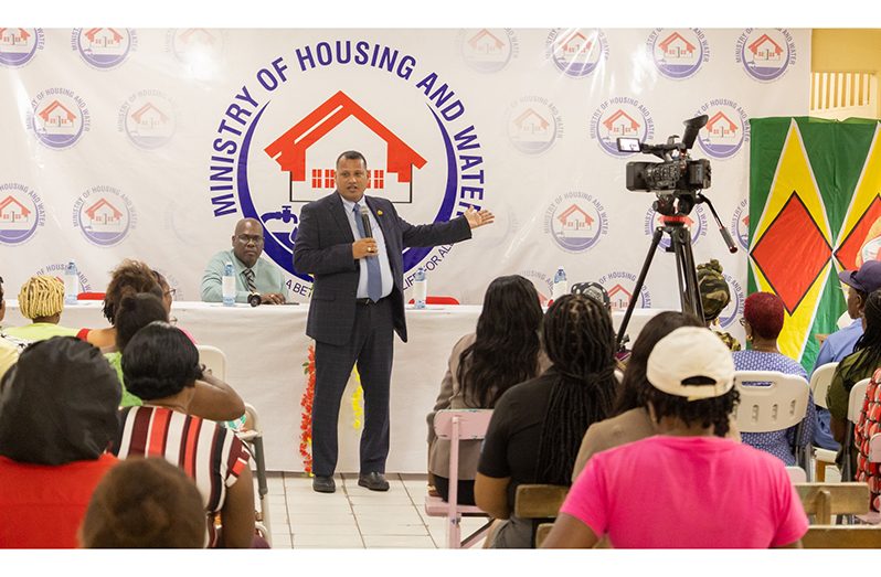 Minister of Housing and Water, Collin Croal engages residents at Tuesday’s grant distribution