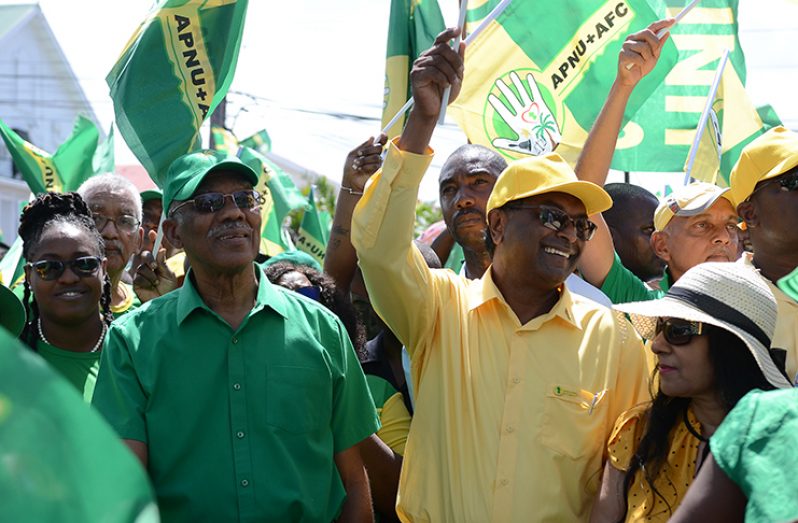 President David Granger and Prime Ministerial candidate of the APNU+AFC coalition arrive at the Umana Yana in Kingston, while crowded by supporters