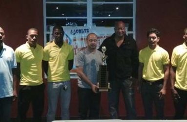 GABA President Michael Singh and GABF President Nigel Hinds, poses with the Philip George Memorial basketball trophy at yesterday’s launching, with other players and officials.