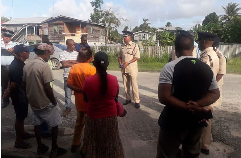 Commander of ‘G’ Division walking through the villages of Wakenaam