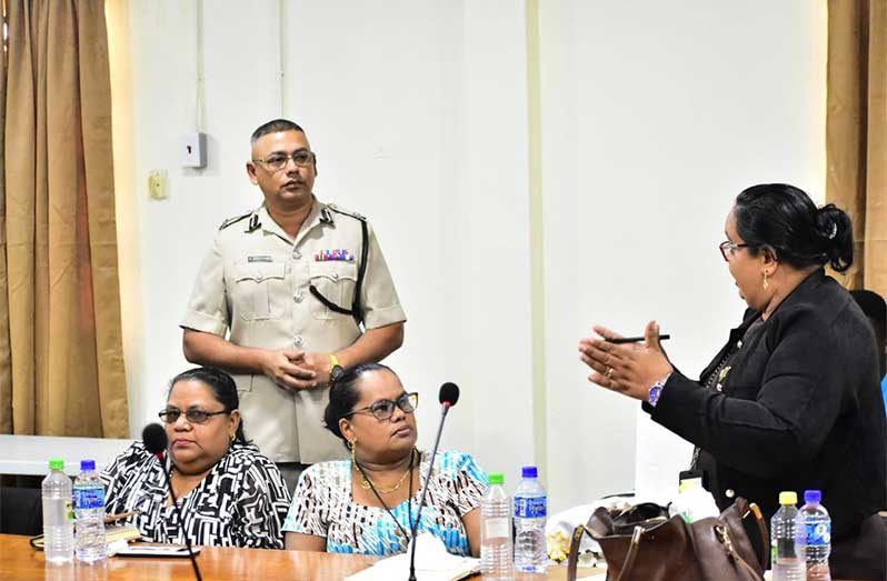 Assistant Commissioner Khali Pareshram listens to one of the many opinions shared at the annual Christmas Policing Presentation in the boardroom of the Region No.4, Regional Democratic Council