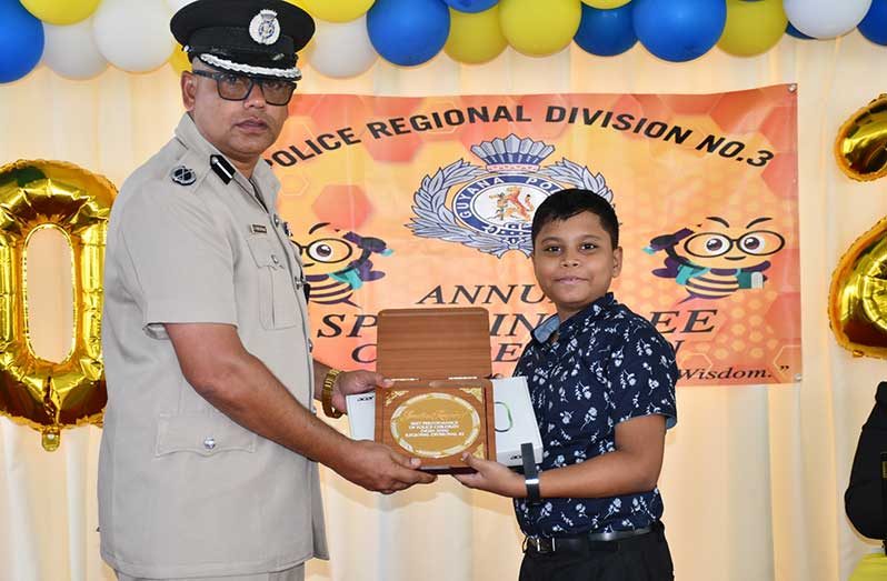 Regional Division #3 Commander, Assistant Commissioner Khali Pareshram presents one of the many prizes to one of the many awardees