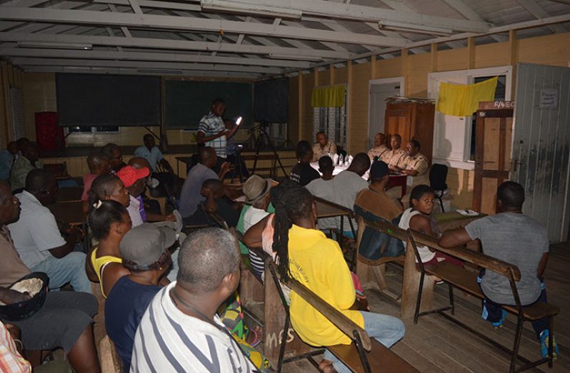 Commander Clifton Hicken and team at Wednesday night’s community meeting at the Mocha Primary School (Photo by Rabindra Rooplall)