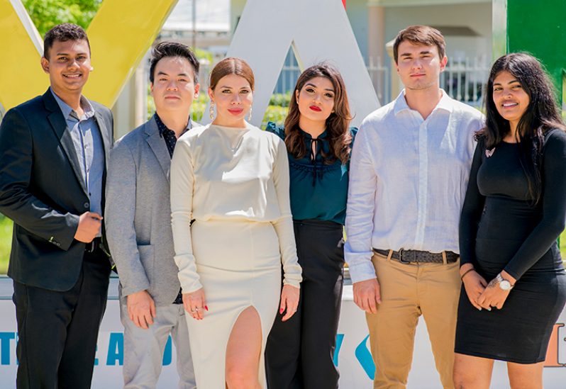 Owner of Century 21 Guyana, Afa Zada (third left) with her team