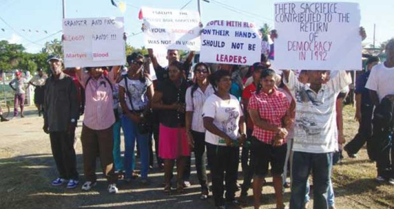 Well-wishers pay tribute to the memory of the ballot box martyrs at last year’s memorial.