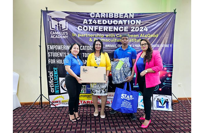 Left to right: Penny Francis (STARR Computer Corporate Sales & Marketing Manager), Ms. Sabrina Ali (Raffle Winner Teacher), Marvin Daly (Technician), and Ms. Camille Deokie Gorakh (Founder/CEO of Camille’s Academy Inc.)