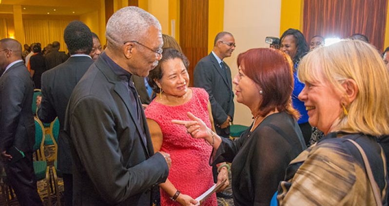 President David Granger and First Lady Sandra Granger interact with Maria Cristina Perceval, UNICEF Regional Director for Latin America and the Caribbean, and Mariane Flach, UNICEF Representative in Guyana at the opening of the Hague Conference Wednesday evening. (Samuel Maughn photo)