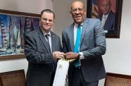 Minister of Foreign Affairs and Foreign Trade, Kerrie Symmonds, presents a welcome gift to Guyana’s new Consul General to Barbados, Harry Gill, at the Ministry of Foreign Affairs and Foreign Trade, on Monday (S. Forde-Craigg/BGIS)