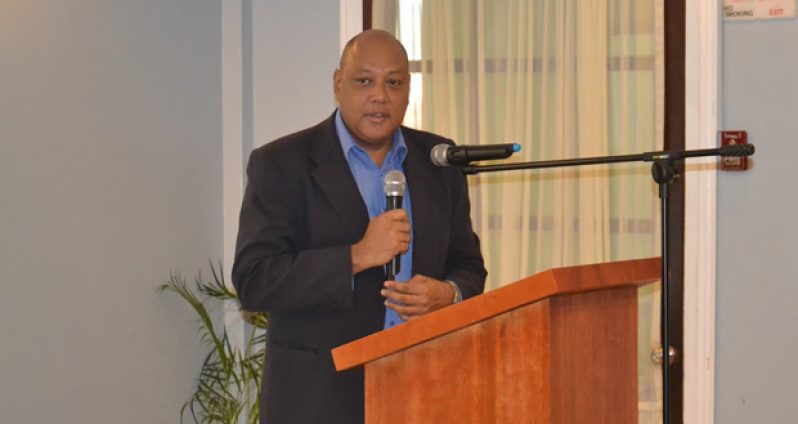 Minister of Governance Raphael Trotman, delivering brief remarks at the event
