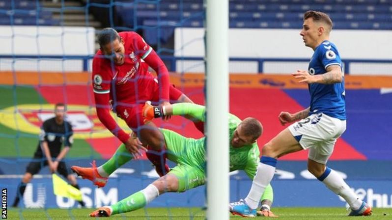 Virgil van Dijk could not continue after Pickford's challenge on him in the first half of the Merseyside derby