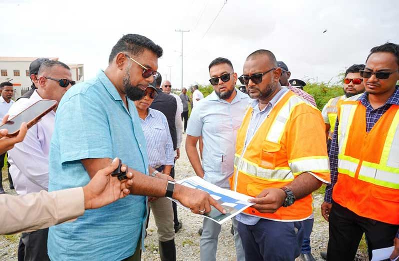 President Irfaan Ali is discussing the road expansion plans with the contractors