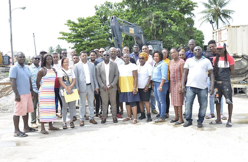 Minister within the Office of the Prime Minister, Kwame McCoy, Minister within the Ministry of Public Works, Deodat Indar and contractors from Albouystown and West La Penitence (DPI photo)