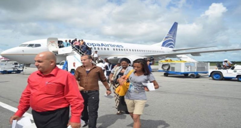 Passengers disembark from a Copa Airlines flight