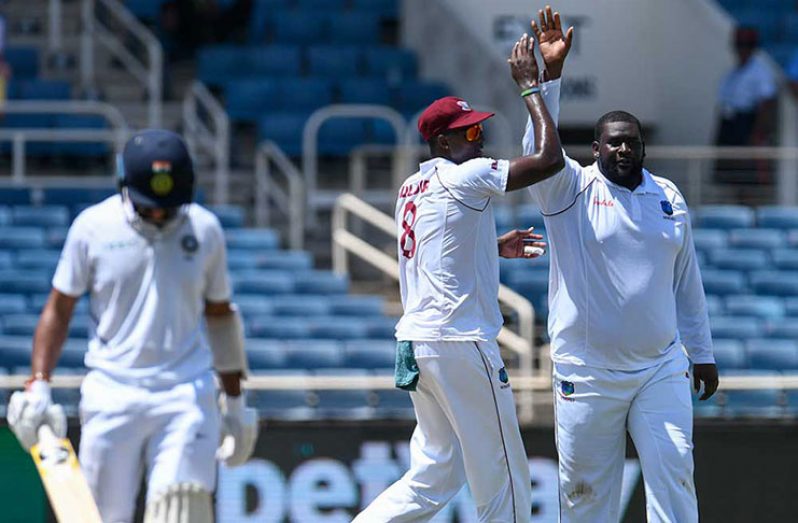 Rahkeem Cornwall celebrates his maiden Test wicket. (Getty)