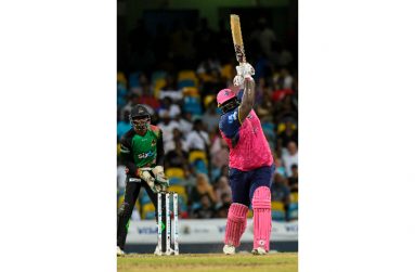 Rahkeem Cornwall hits down the ground during his 100 against St Kitts and Nevis Patriots. (Photo courtesy CPLT20/Getty Images)