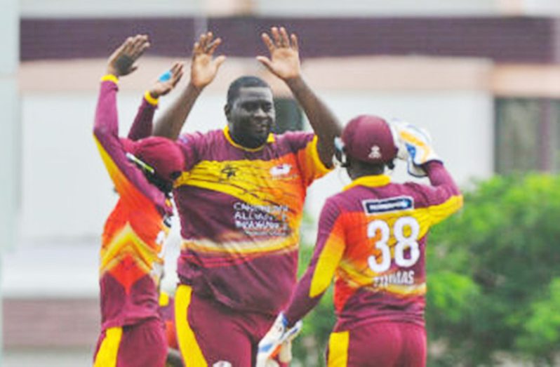 Kahkeem Cornwall (centre) took six wickets to help rout the Windward Islands vOLCANOES