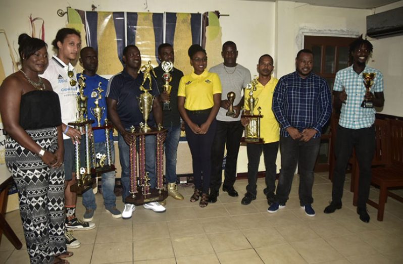 Respective finishers of the inaugural Corona Invitational football tournament pose with sponsors and officials. (Adrian Narine photo)