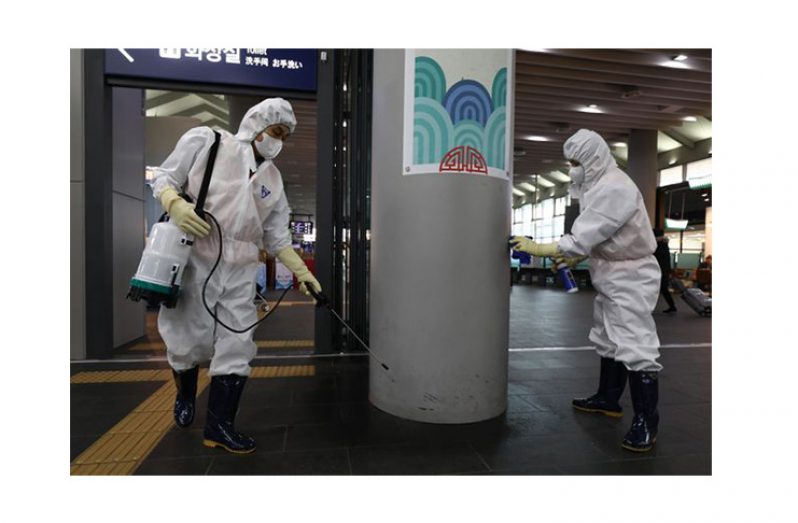 Disinfection workers wearing protective gears spray anti-septic solution in an train terminal amid rising public concerns over the spread of China's Wuhan Coronavirus at SRT train station on January 24, 2020 in Seoul, South Korea. (Huffington Post/Getty Images)