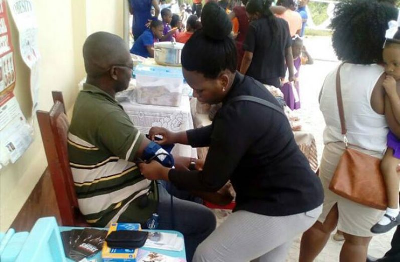Dr. Shonette Hercules-Couchman attending to a patient during the Pine Street Nursery School fair earlier this year