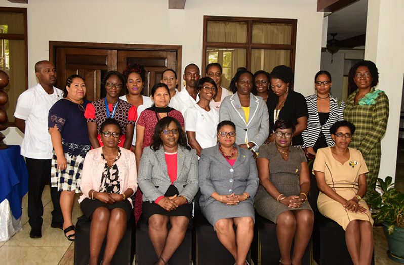 Public Health Minister Volda Lawrence and Minister within the Ministry of Public Health Dr. Karen Cummings, sitting in the presence of health sector officials and members of the new General Nursing Council of Guyana. 
(Photo by Adrian Narine)