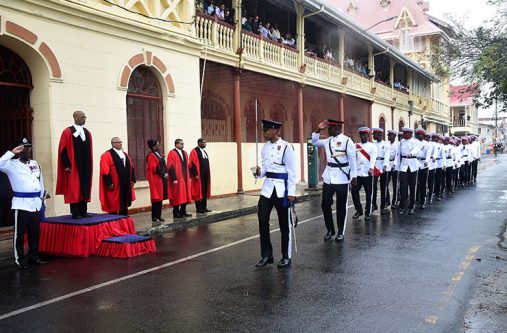 Justice Brassington Reynolds takes the salute from the police Guard of Honour at yesterday’s opening of the January criminal sessions at the Demerara Assizes (Adrian Narine photo)
