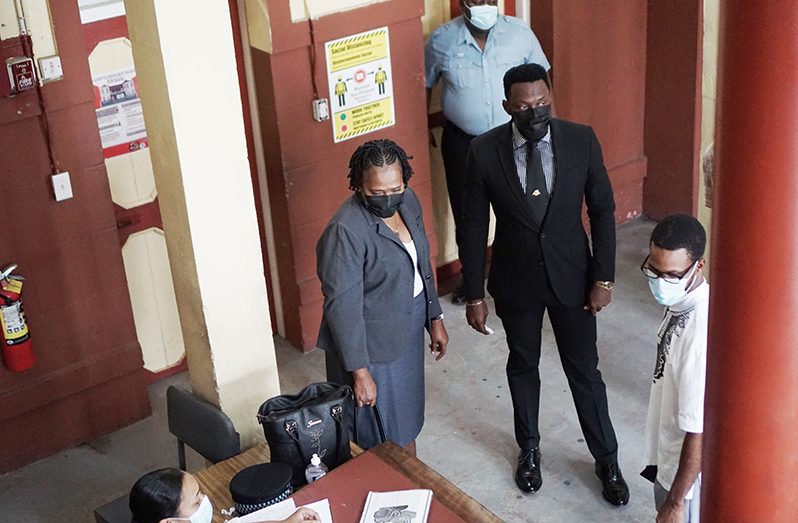 A Partnership For National Unity + Alliance For Change (APNU+AFC) Members of Parliament, Christopher Jones and Annette Ferguson at the Georgetown Magistrates’ Court on Friday (Elvin Croker Photo)