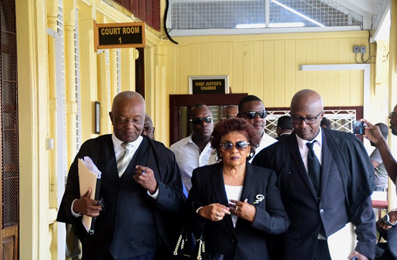hairman of GECOM, Justice (Ret’d) Claudette Singh leaving the High Court in the presence of GECOM’s Attorneys-at-Law – Senior Counsel Neil Boston (left) and Attorney Robin Hunte (right)  (Photos by Adrian Narine )