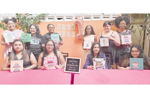 Founder of The Literary Coven GY Book Club, Devica Uditram (second from left seated), with members of her book club