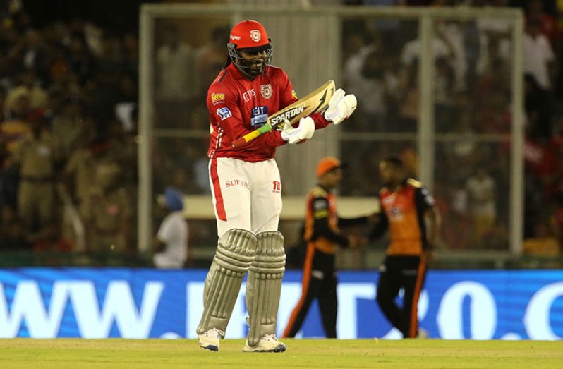 Chris Gayle celebrated his sixth IPL hundred and 21st overall with the 'cradle' celebration. He later dedicated the innings to his daughter, who will turn two today. (©BCCI)