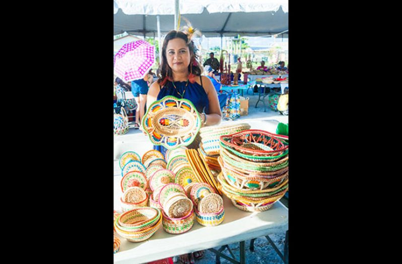 Miranda Bernard displaying one of her pieces at the Indigenous Food and Craft Exhibtion in 2016. (Guyana Chronicle Photo)